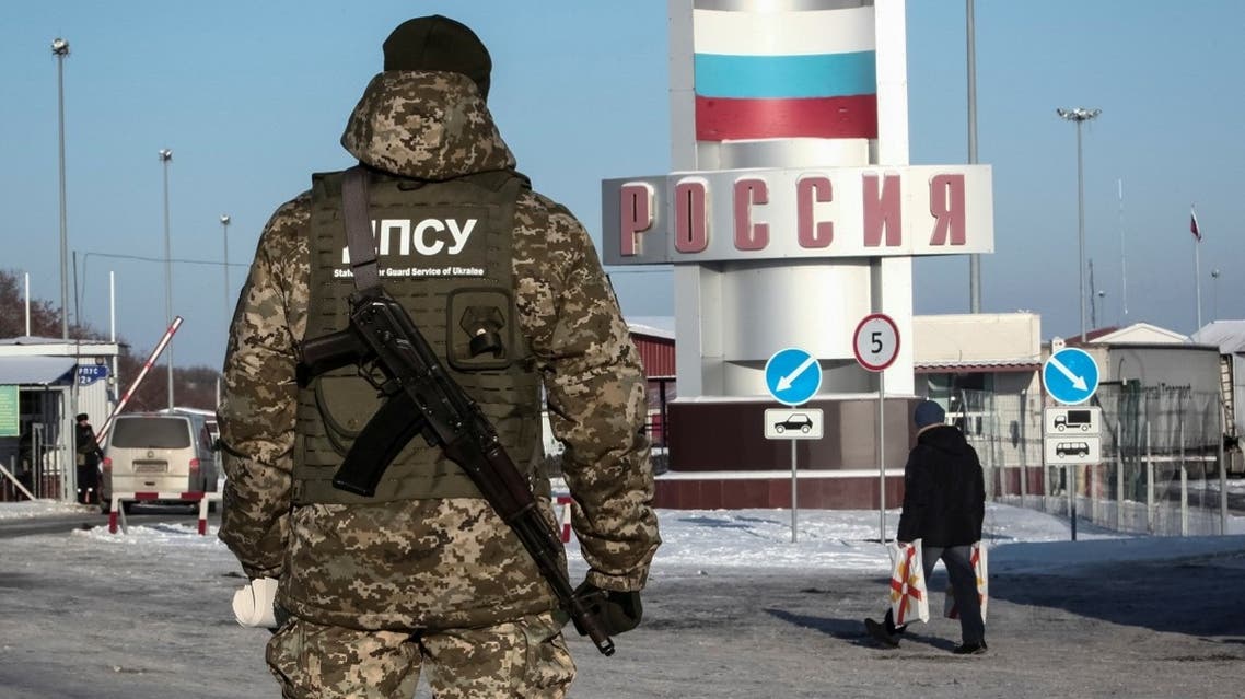 A member of the Ukrainian State Border Guard Service stands guard at the Goptovka crossing point on the border between Russia and Ukraine in Kharkiv Region, Ukraine.