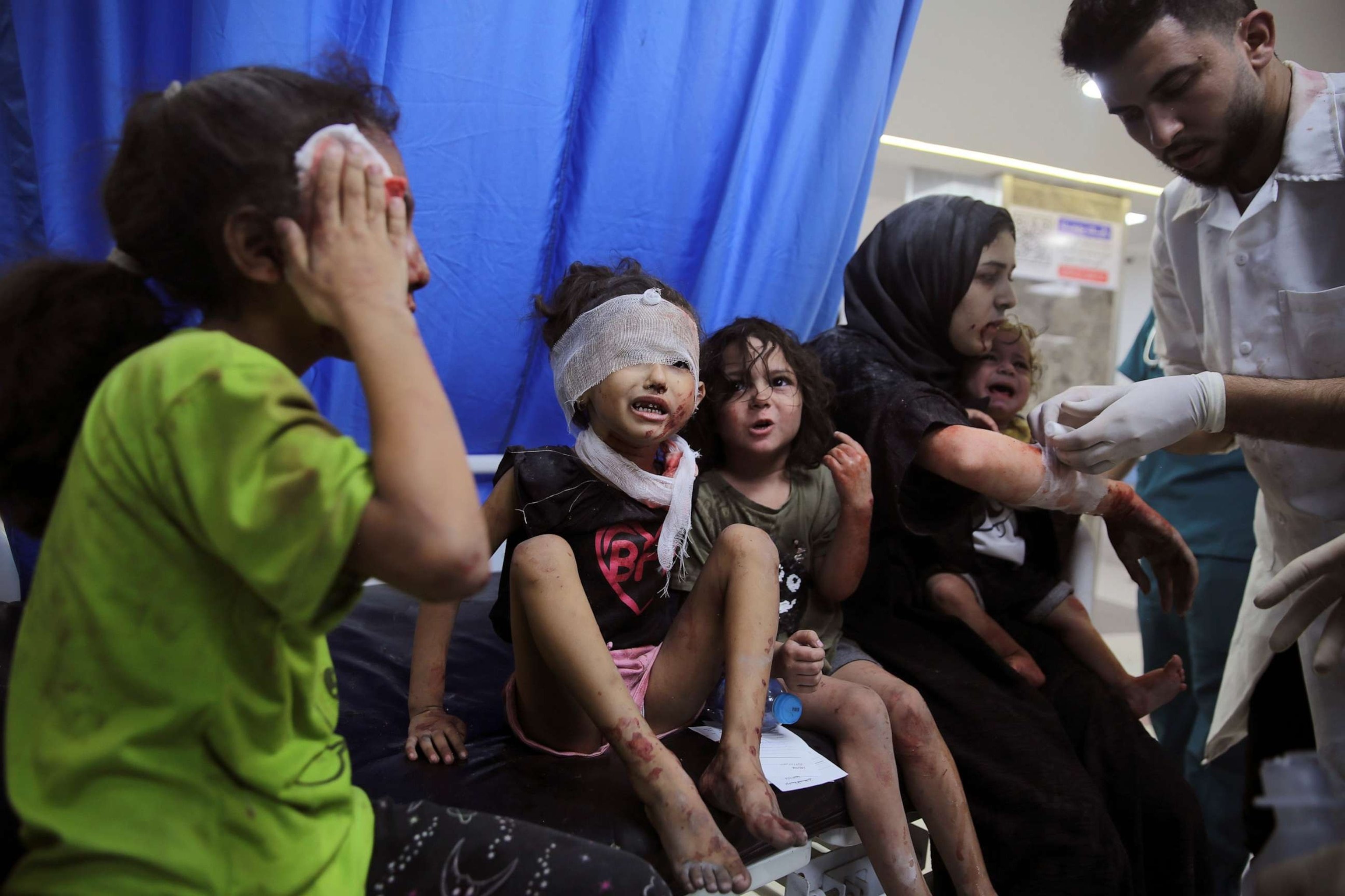 Palestinian children wounded in Israeli strikes are brought to Shifa Hospital in Gaza City on Oct. 11, 2023. Photo: AP.