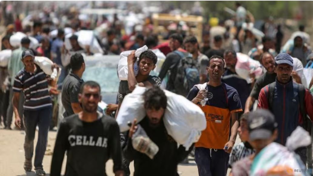 Palestinians collect aid supplies from the US-backed Gaza Humanitarian Foundation, in Rafah, in the southern Gaza Strip, on Jun 9, 2025. (Photo: REUTERS/Hatem Khaled)