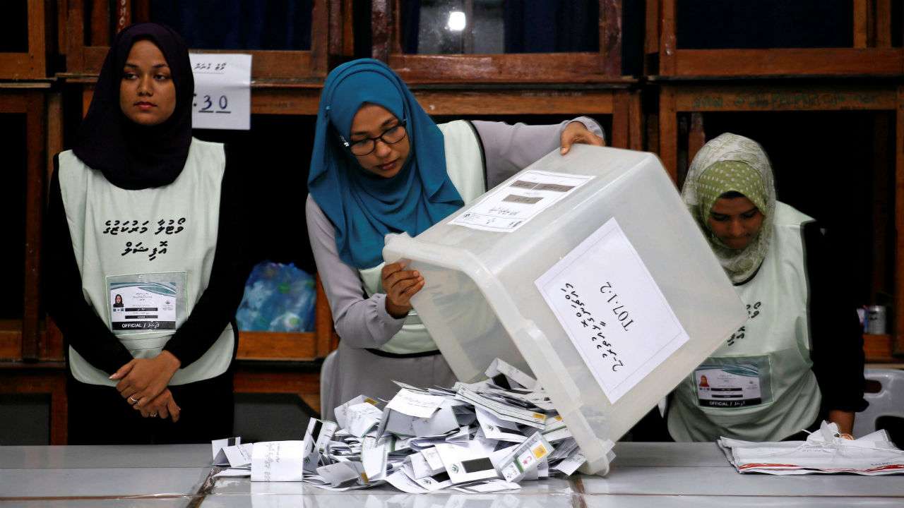 Maldives election commission officials prepare ballot papers for counting votes - Elections/2018