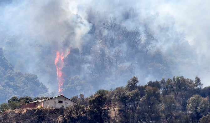 Heavy smoke rises during a wildfire in the forested hills of the Kabylie region, east of the Algerian capital Algiers, on August 11, 2021. (Photo: AFP)