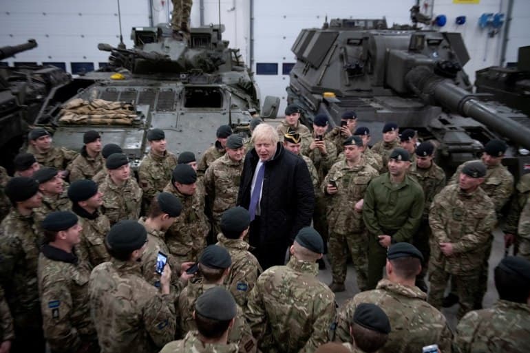 British Prime Minister Boris Johnson, pictured with UK troops stationed in Estonia, says the UK is offering to increase its deployment amid rising 'Russian hostility'