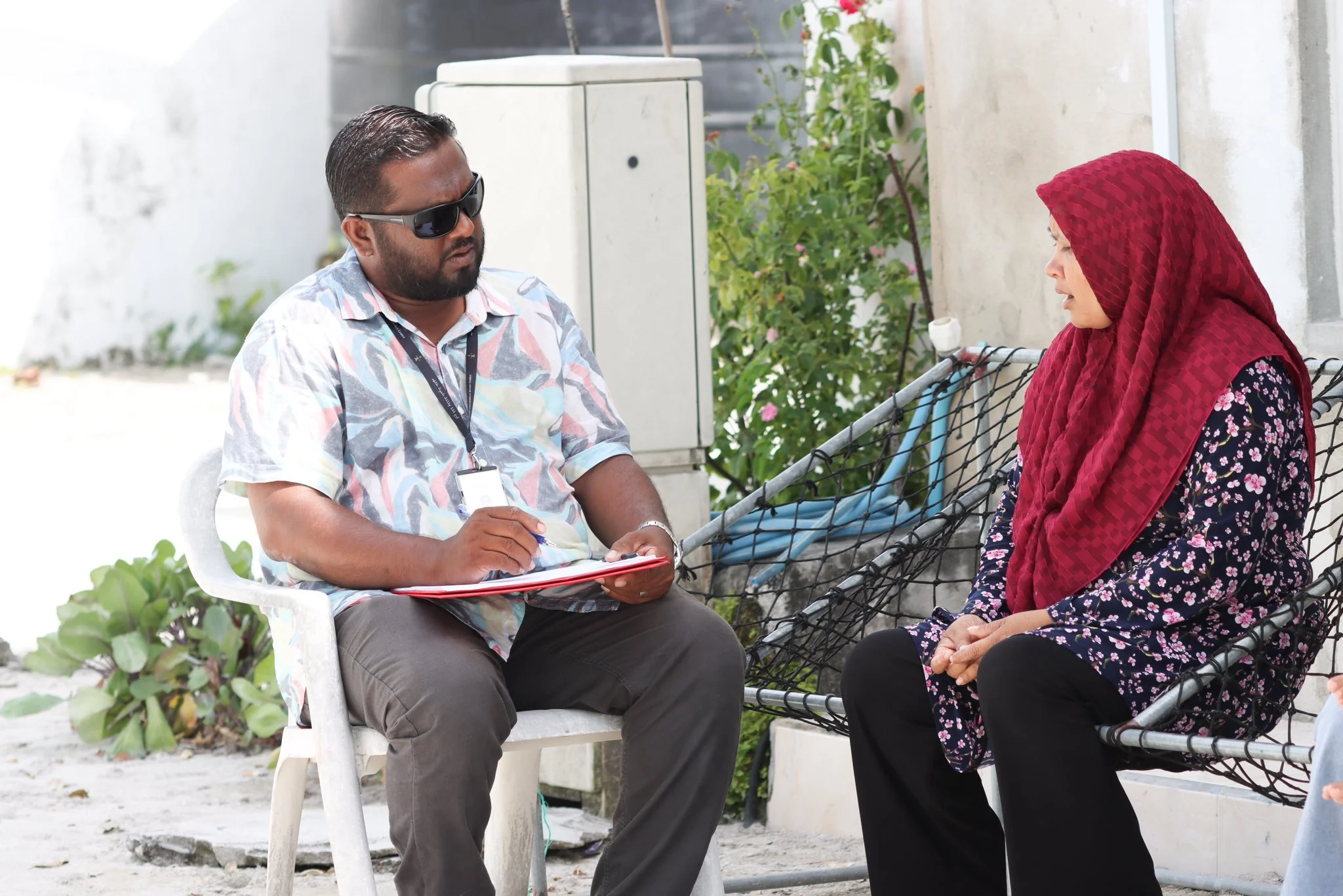 Ministry of Gender, Family, and Social Services team visiting homes under 'Haalu Belun' program.