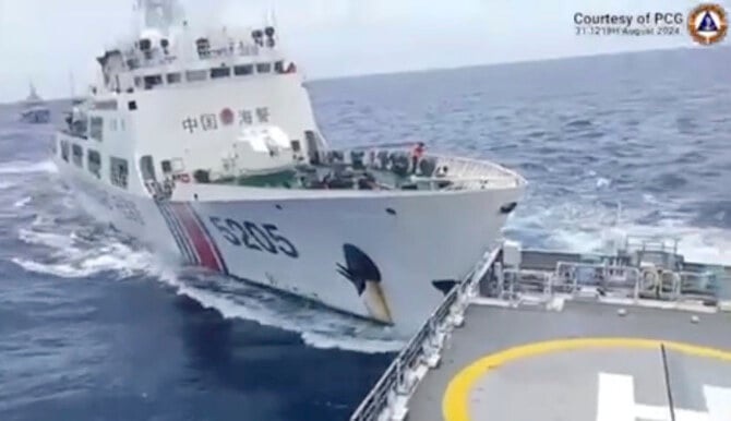 a Chinese Coast Guard ship, right, collides with Philippine Coast Guard vessel near the Sabina Shoal at the disputed South China Sea on Aug. 31, 2024. (Philippine Coast Guard via AP)