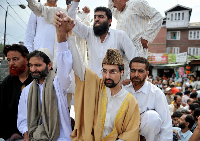 Jammu Kashmir Liberation Front (JKLF) chairman Muhammad Yasin Malik (L).