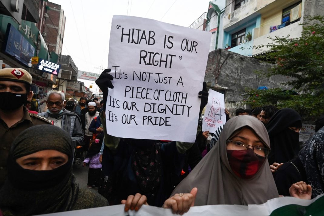 Activists march during a demonstration in New Delhi, to protest after students at government-run high schools in India's Karnataka state were told not to wear hijabs.