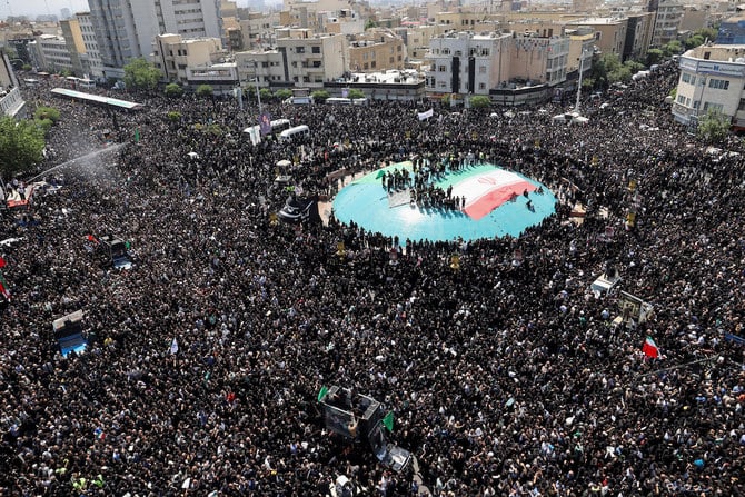 Mourners attend the funeral for Iran’s President Ebrahim Raisi, Foreign Minister Hossein Amirabdollahian and others in Tehran on May 22, 2024. (WANA via Reuters)