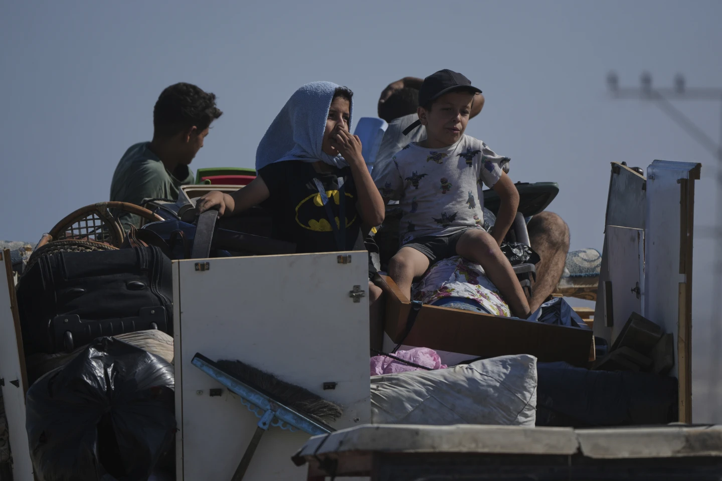 Displaced Palestinians carry belongings along Gaza’s coastal road toward the south after Israeli evacuation orders, Sept. 9, 2025.