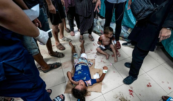 Palestinian children wounded in the Israeli bombardment of the Gaza Strip are treated in a hospital in Deir al-Balah, Thursday (AP)