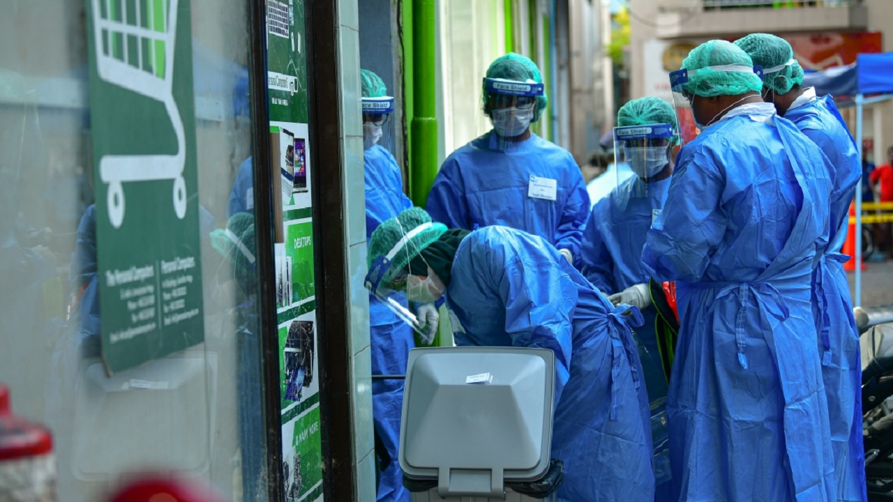 Rapid Response Team (RRT) officials collecting Covid test samples. Photo: HPA