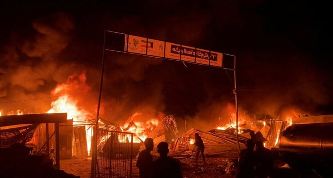 Fire rages following an Israeli strike on an area designated for displaced Palestinians in Rafah , southern Gaza Strip, May 26, 2024. (REUTERS)