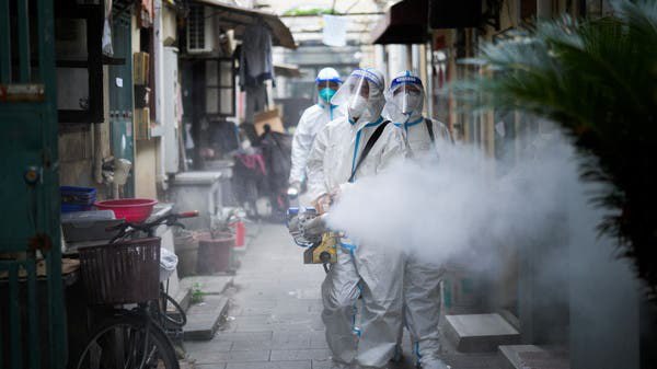 Workers in protective suits disinfect an old residential area under lockdown amid the coronavirus disease (COVID-19) pandemic, in Shanghai, China. (Photo: Reuters)