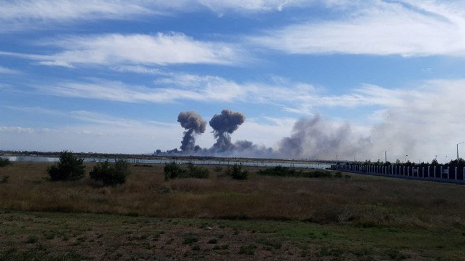 Smoke rises after explosions were heard from the direction of a Russian military airbase near Novofedorivka, Crimea.