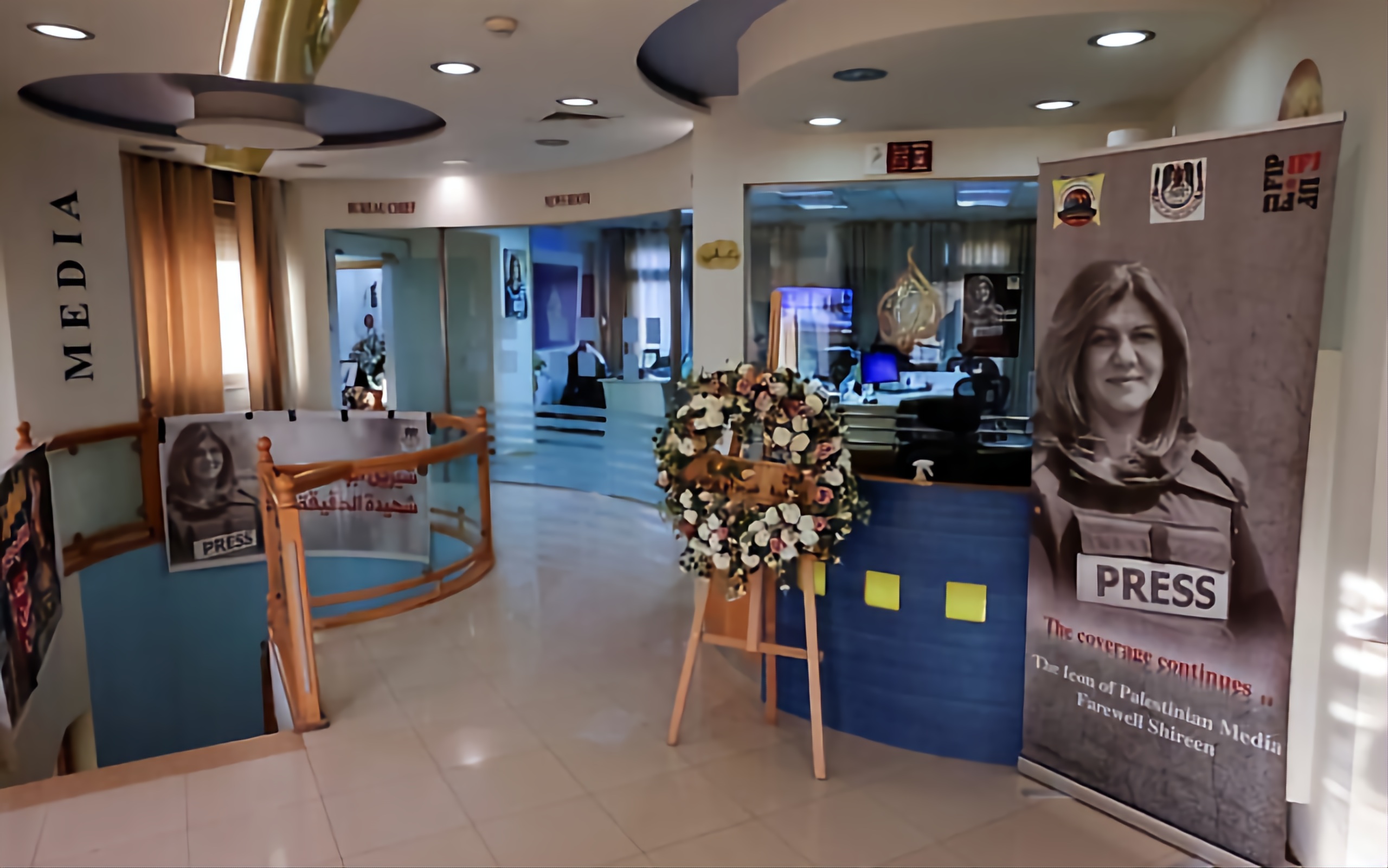 Pictures of slain Al Jazeera journalist Shireen Abu Akleh are displayed inside the news channel's office in Ramallah. Photo AFP.