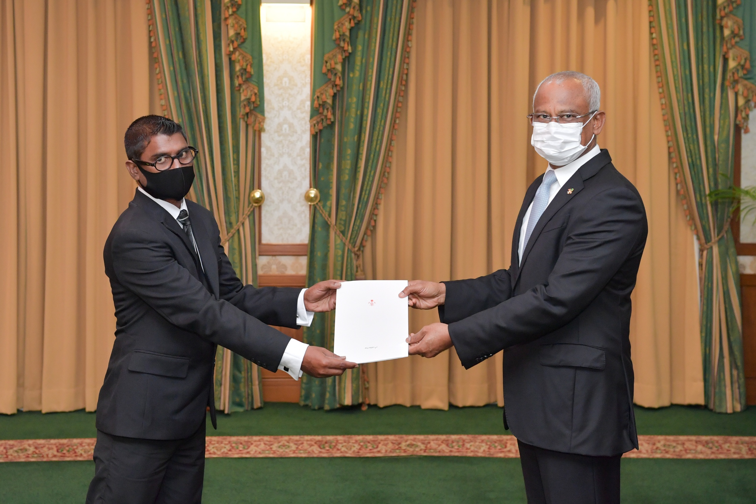 Mohamed Fazeen receiving the Letter of Appointment today. Photo: President's Office.