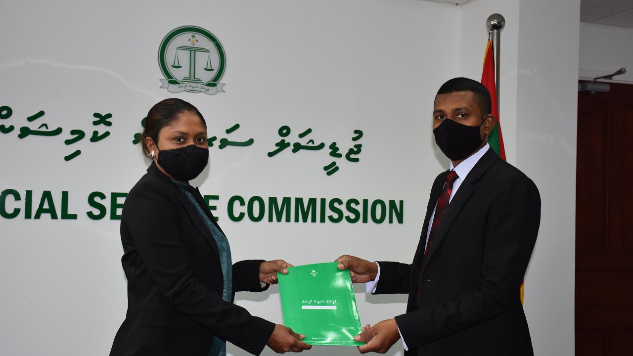 JSC president Hisaan Hussain presenting Ahmed Shakeel, the letter of appointment as the Chief Judge.