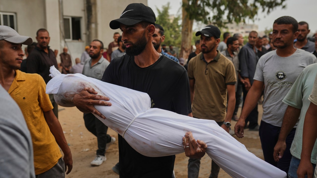 A relative carries the body of Palestinian child Muath Al-Basus, killed in an Israeli strike, during his funeral in Gaza City on Sept. 4, 2025. (AP Photo/Jehad Alshrafi)
