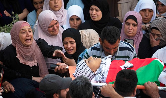 during the funeral of Mohammad Hamayel, 15, who was killed during clashes with Israeli security forces in Beita, West Bank.