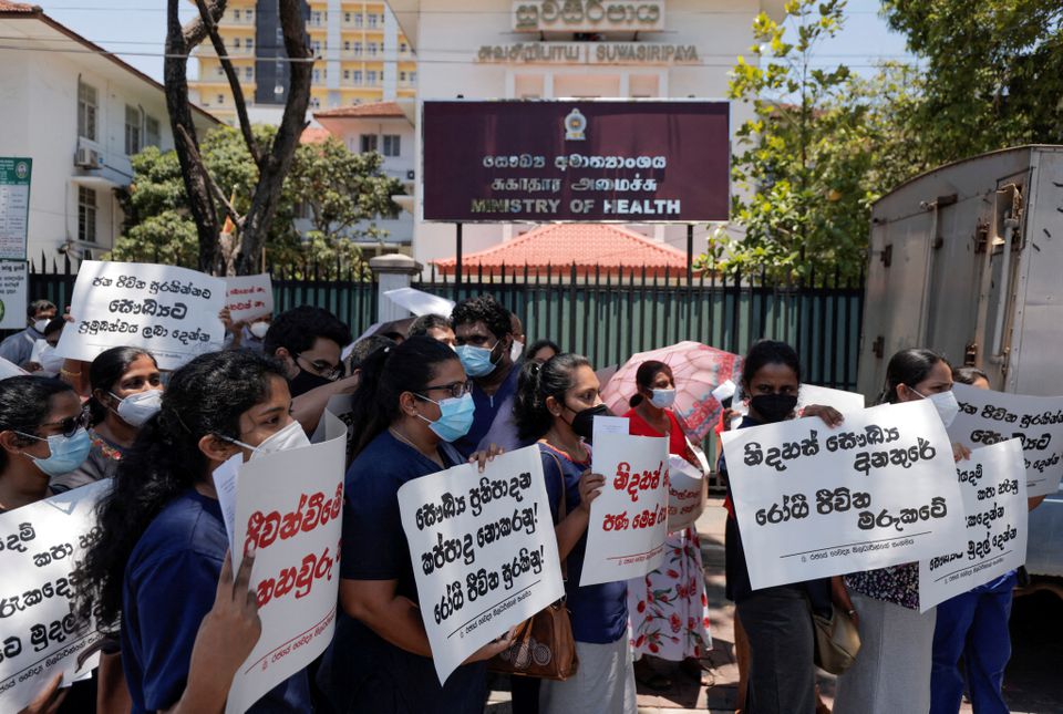 Government Medical Officers' Association members with placards protesting against Sri Lankan President Gotabaya Rajapaksa.
