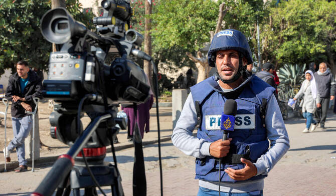 Al Jazeera correspondent Mohammed Qreiqeh reports in Gaza City on December 1, 2024. (AFP)