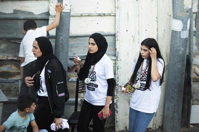 Palestinian activist Muna Al-Kurd (center). Photo: AP