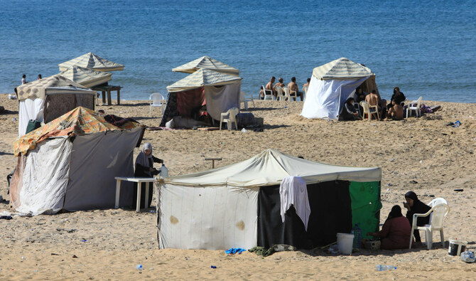 Tents are set up to be used as temporary shelters by people who fled Israeli bombardment, along the Ramlet Al-Bayda public beach in Beirut on October 5, 2024. (AFP)