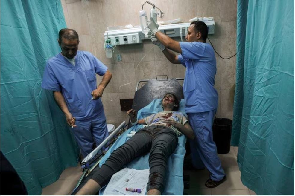 A Palestinian girl wounded during an Israeli airstrike receives medical treatment at al-Aqsa hospital in Deir el-Balah, central Gaza Strip.