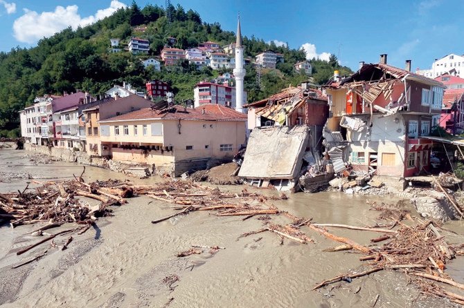 Partially damaged buildings in an area hit by flashfloods that swept through the town of Ilisi in Turkey’s Black Sea region this July.