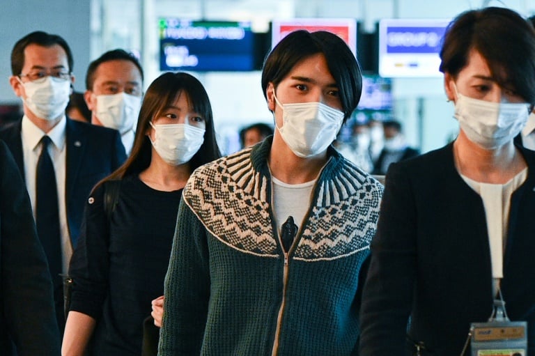 Japan's former princess Mako Komuro (send left) and her husband Kei Komuro (second right).