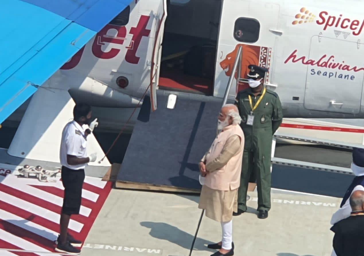 PM Narendra Modi briefed by the Maldivian Aero cabin crew before boarding the seaplane.