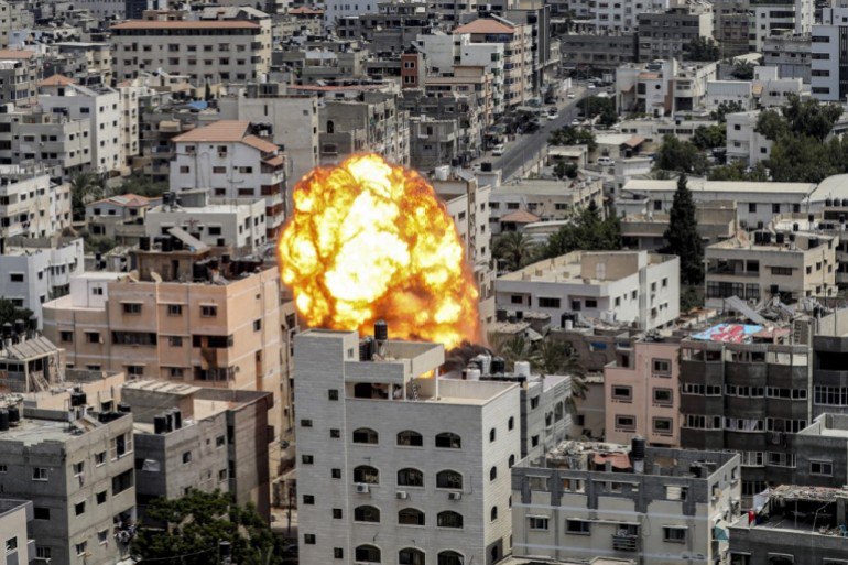 A fireball erupts as a result of an Israeli air raid on a building in Gaza City on Friday. (Photo: Ashraf Amra/AFP)