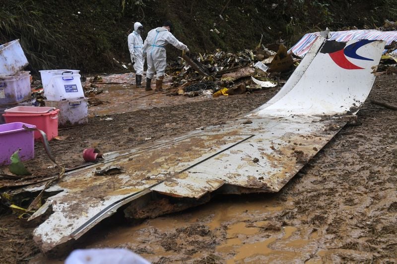 Rescuers conduct search and rescue work at the site of a China Eastern Airlines Boeing 737 on March 26.