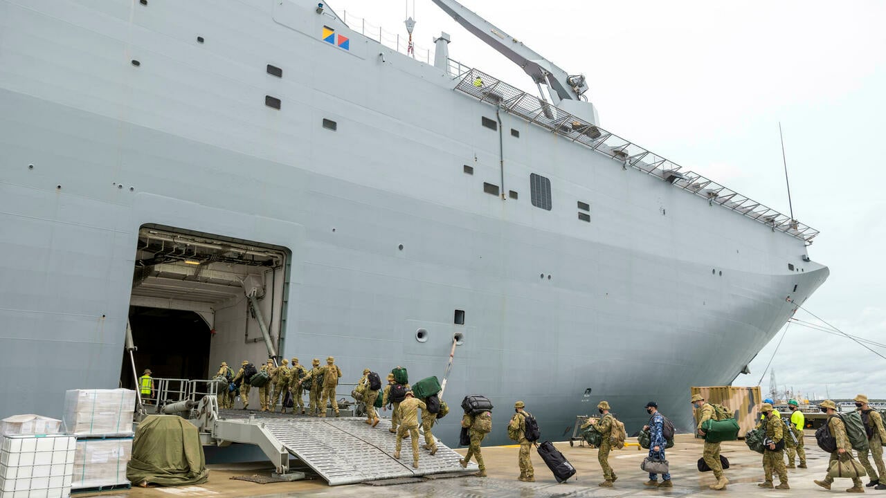 Members of the Australian Defence Force boarding the HMAS Adelaide in Brisbane earlier this month, before setting sail for Tonga.