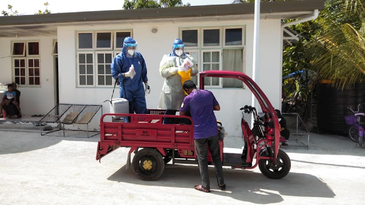 Rapid Response Team (RRT) officials collecting Covid test samples from Kolhufushi island.