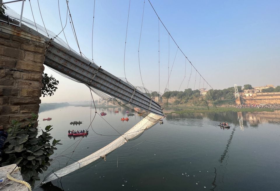 Rescuers search for survivors after a suspension bridge collapsed in Morbi town in the western state of Gujarat, India, October 31, 2022. REUTERS/Stringer